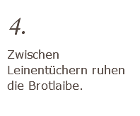 4. Zwischen Leinentüchern ruhen die Brotlaibe. 
